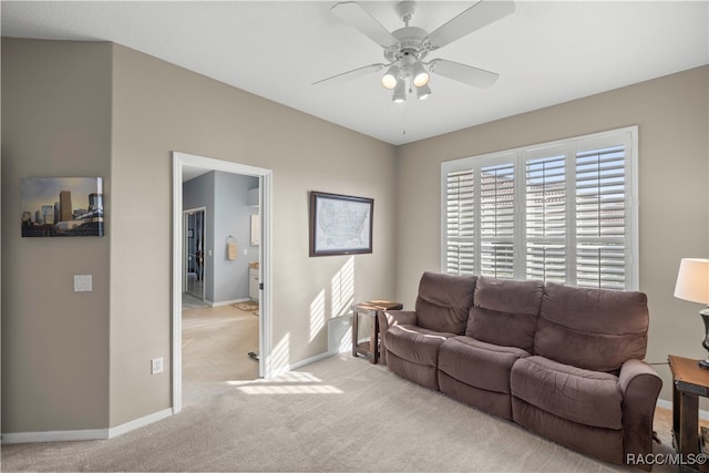 living room with light carpet and ceiling fan