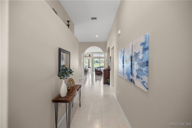 hall with light tile patterned flooring