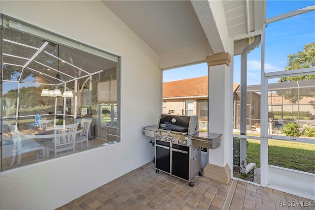 sunroom with lofted ceiling