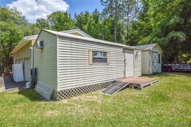 exterior space featuring a yard and a storage shed