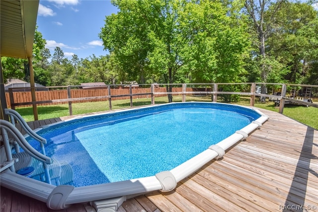 view of pool featuring a wooden deck