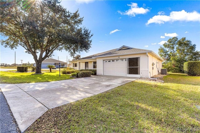 ranch-style home with a garage, a front yard, and central AC