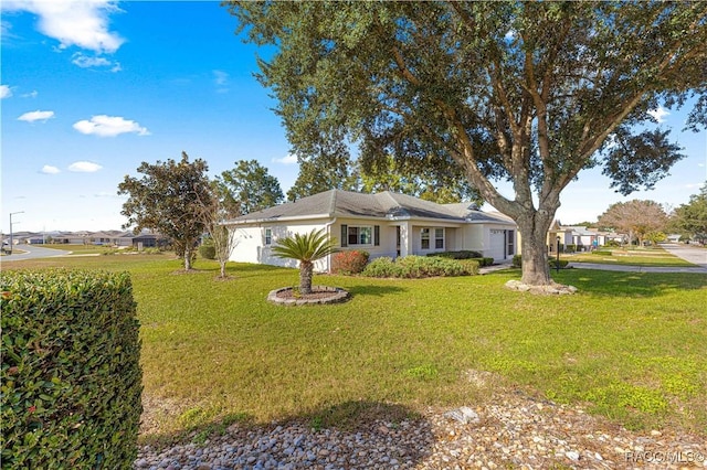 ranch-style home with a front yard