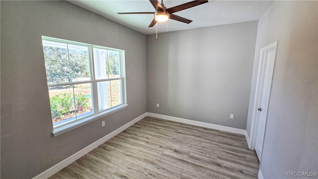 unfurnished room featuring ceiling fan and light wood-type flooring