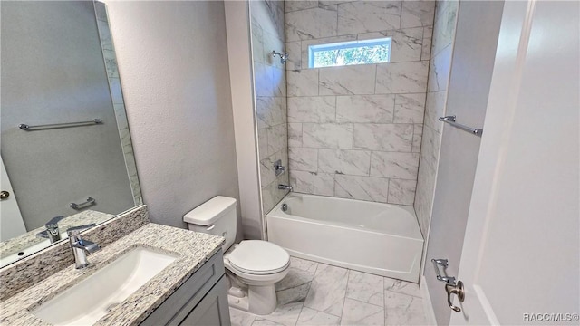 full bathroom featuring vanity, toilet, and tiled shower / bath