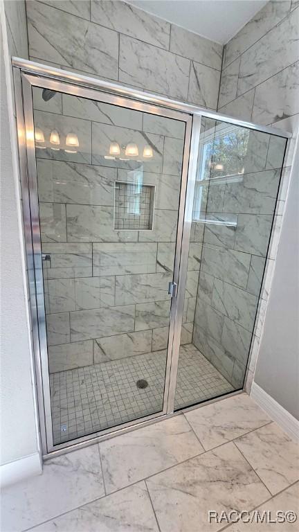 bathroom with an enclosed shower