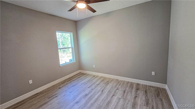 unfurnished room featuring light hardwood / wood-style flooring and ceiling fan