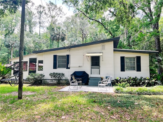 back of property with a patio area