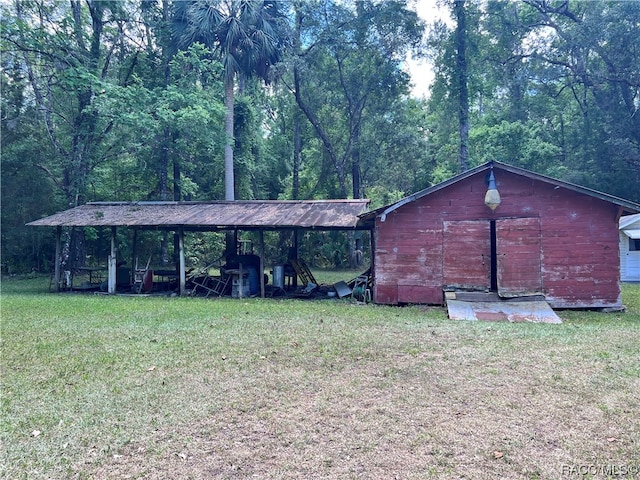 view of outdoor structure with a lawn