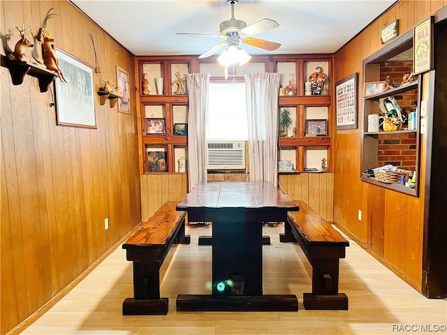 interior space featuring wood walls and light hardwood / wood-style flooring