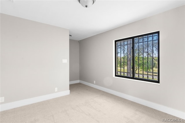 empty room with light colored carpet