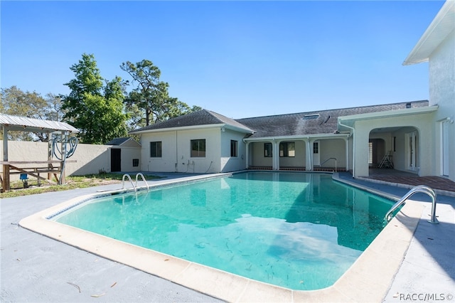 view of swimming pool featuring a patio