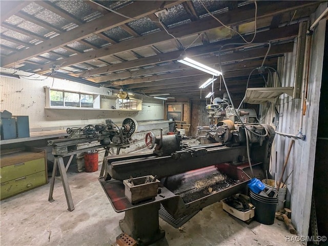 misc room featuring concrete floors and a workshop area