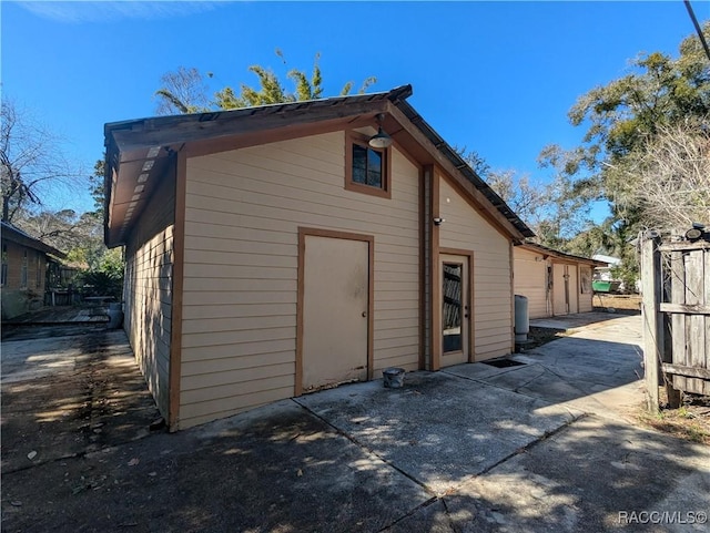 back of house with a patio