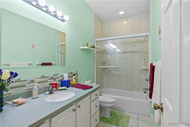 7634 N Hargrove Pt, Crystal River, FL 34428 - full bathroom featuring tile patterned floors, vanity, tasteful backsplash, and washtub / shower combination