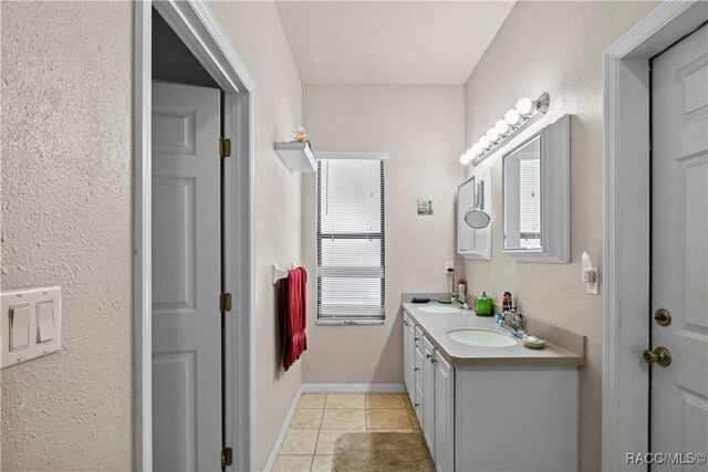 7634 N Hargrove Pt, Crystal River, FL 34428 - full bathroom with double vanity, healthy amount of natural light, and tile patterned flooring