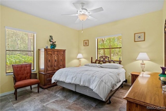 7634 N Hargrove Pt, Crystal River, FL 34428 - bedroom with baseboards and ceiling fan