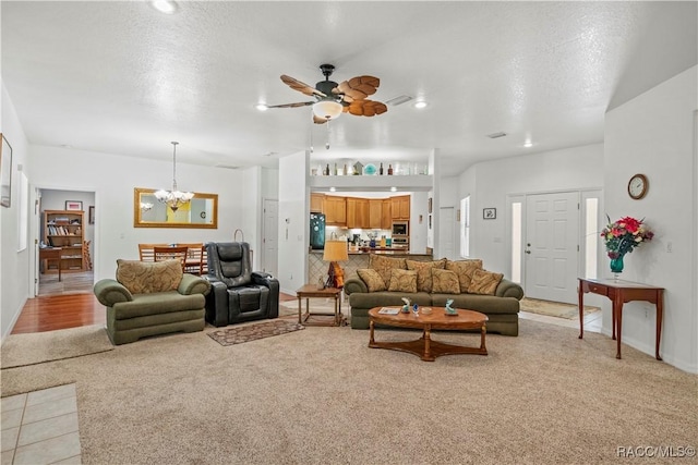 7634 N Hargrove Pt, Crystal River, FL 34428 - living area with light colored carpet, a chandelier, and ceiling fan