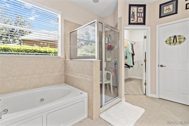 bathroom featuring separate shower and tub and tile patterned floors