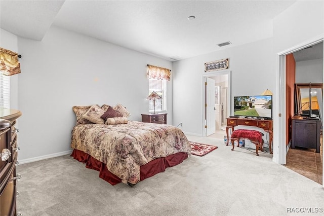 bedroom with light colored carpet