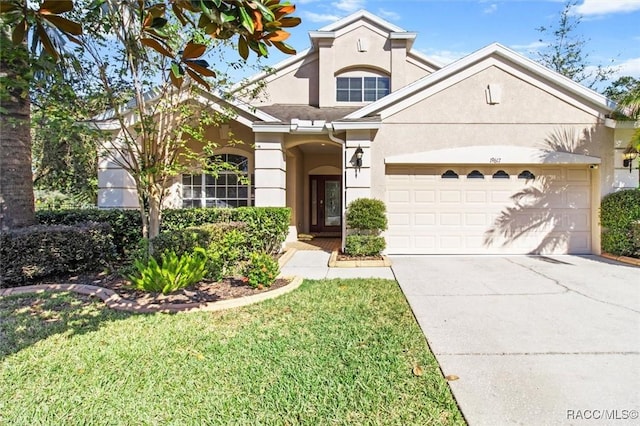 view of front of house featuring a front yard and a garage