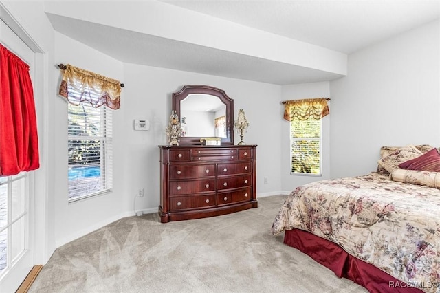 bedroom with light carpet