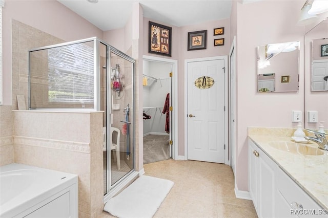 bathroom with plus walk in shower and vanity