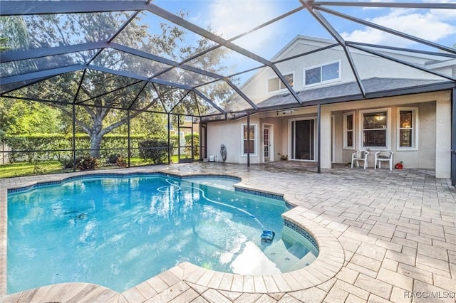 view of pool featuring a lanai and a patio