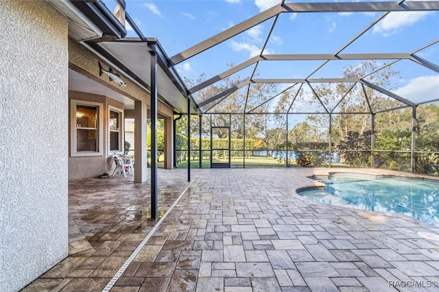 view of pool with a lanai and a patio