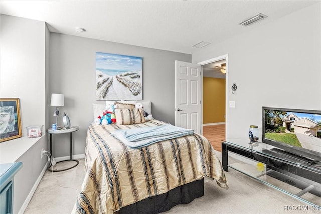 bedroom featuring light colored carpet