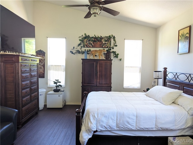 bedroom with ceiling fan, dark hardwood / wood-style flooring, and lofted ceiling