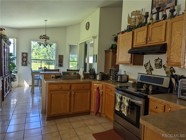 kitchen with kitchen peninsula, light tile patterned floors, electric range, and pendant lighting