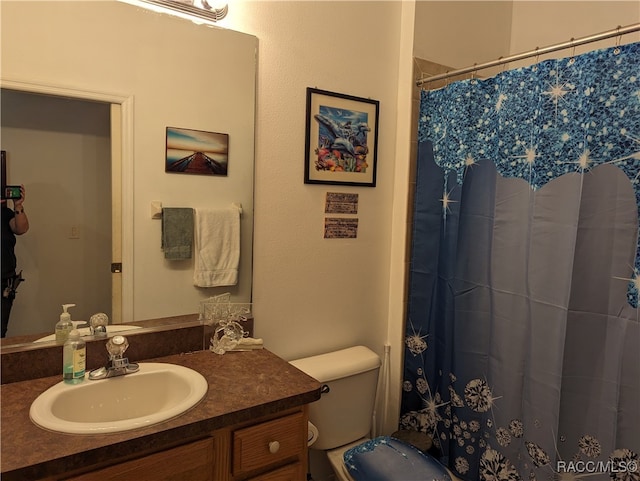 bathroom with vanity and toilet