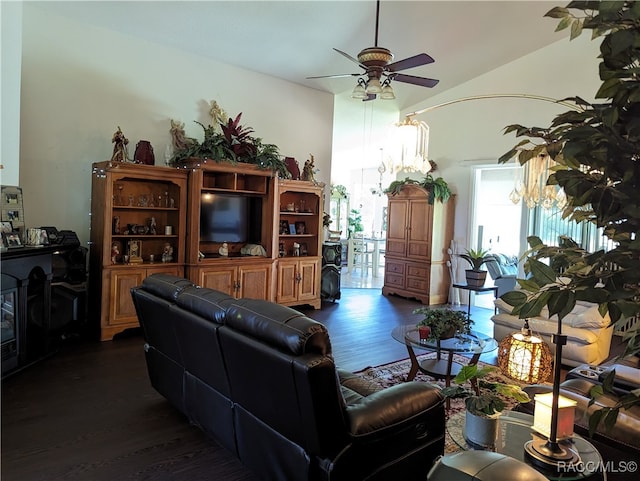 living room with lofted ceiling, ceiling fan, and dark wood-type flooring