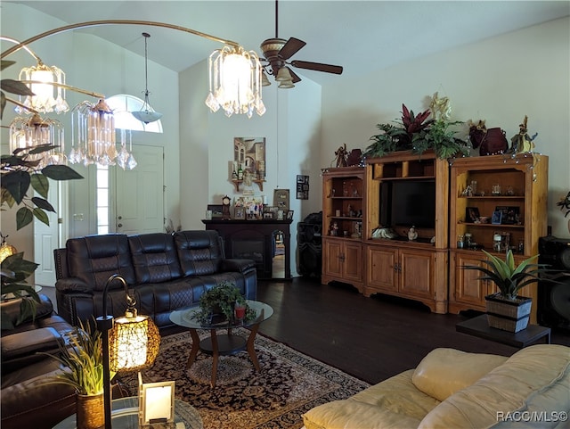 living room featuring ceiling fan and dark wood-type flooring