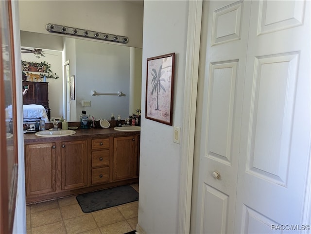 bathroom featuring tile patterned flooring, vanity, and ceiling fan