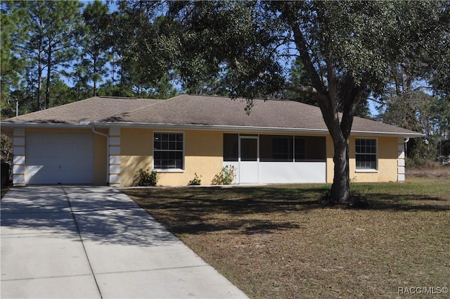 single story home with a garage and a front yard