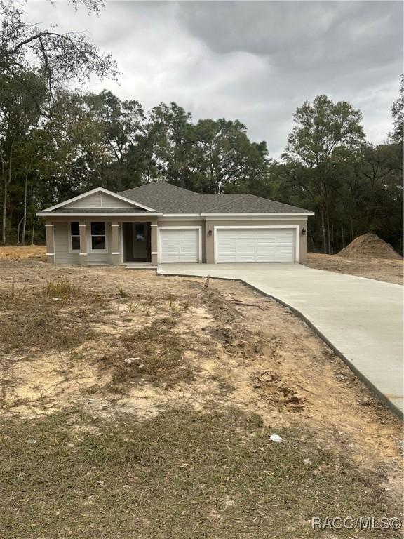 single story home featuring a garage