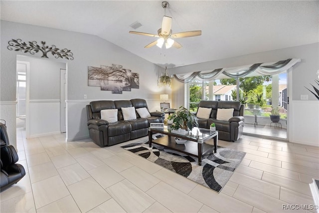 8849 SW 116th Place Rd, Ocala, FL 34481 - living room featuring vaulted ceiling, ceiling fan, and wainscoting