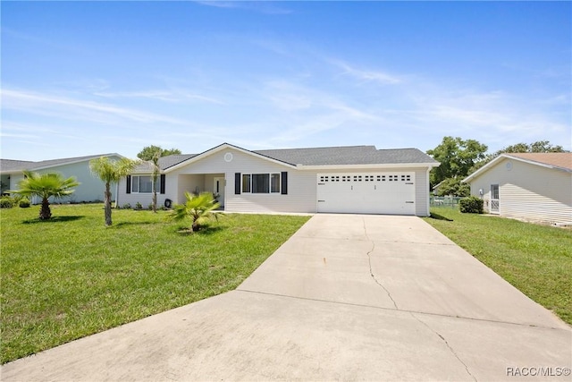 8849 SW 116th Place Rd, Ocala, FL 34481 - single story home featuring concrete driveway, a garage, and a front yard