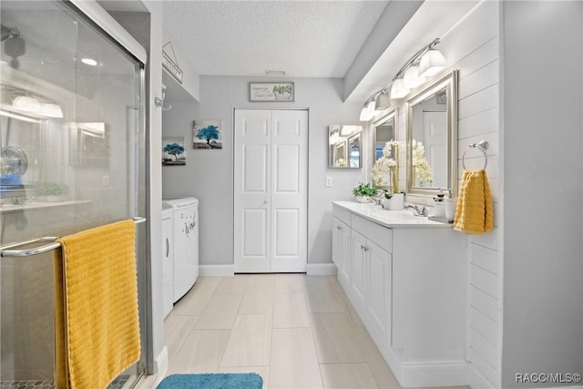 8849 SW 116th Place Rd, Ocala, FL 34481 - full bath with independent washer and dryer, a shower stall, vanity, a textured ceiling, and baseboards