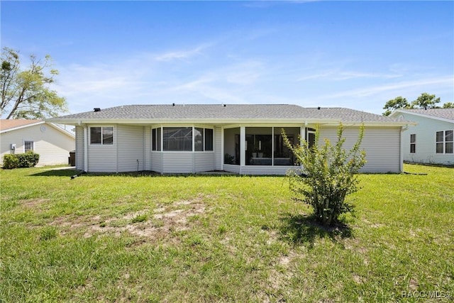 8849 SW 116th Place Rd, Ocala, FL 34481 - back of property with a lawn and a sunroom