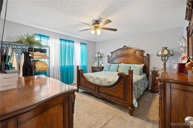 8849 SW 116th Place Rd, Ocala, FL 34481 - carpeted bedroom with a textured ceiling and ceiling fan