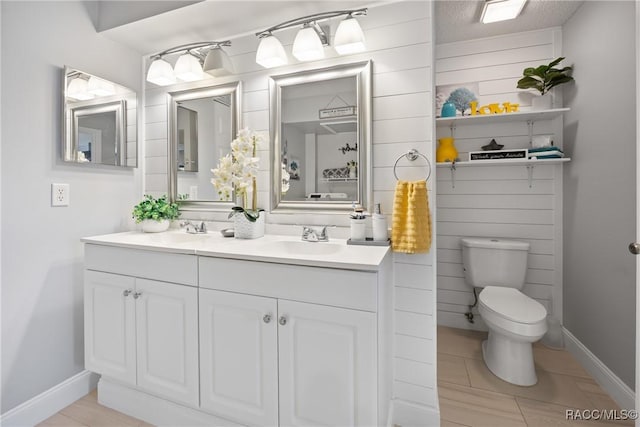 8849 SW 116th Place Rd, Ocala, FL 34481 - full bathroom featuring toilet, double vanity, baseboards, and tile patterned floors
