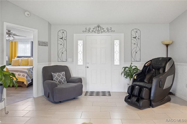 8849 SW 116th Place Rd, Ocala, FL 34481 - foyer entrance featuring a wainscoted wall and ceiling fan