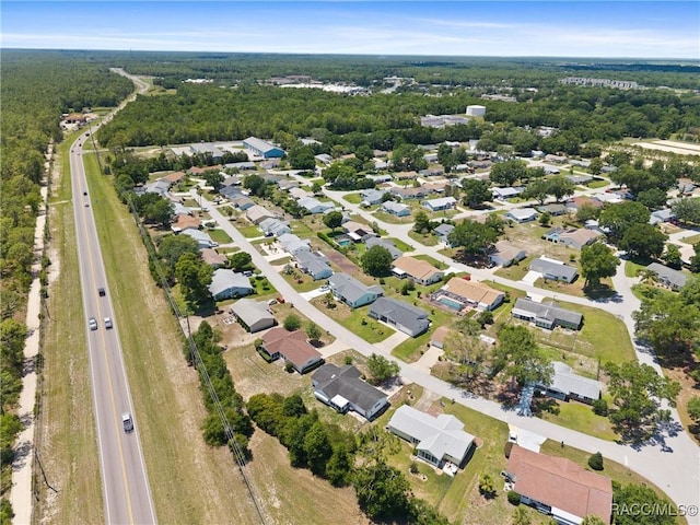8849 SW 116th Place Rd, Ocala, FL 34481 - aerial view of property's location with nearby suburban area and a forest
