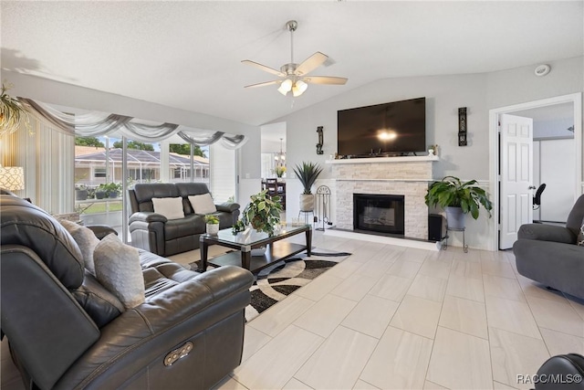 8849 SW 116th Place Rd, Ocala, FL 34481 - living room with a ceiling fan, vaulted ceiling, and a stone fireplace