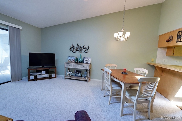 carpeted dining space featuring an inviting chandelier