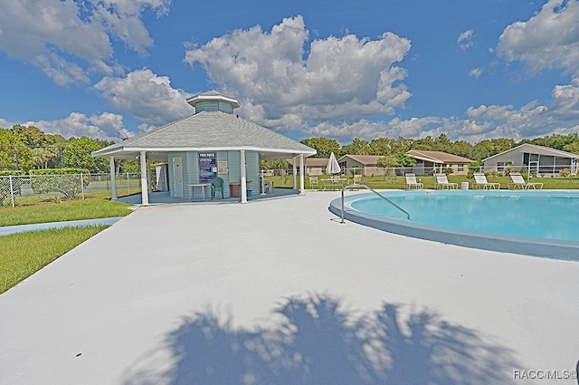 view of swimming pool featuring a patio