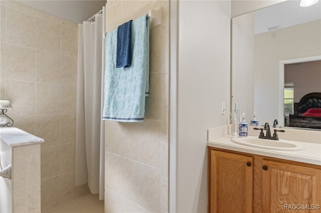 bathroom with vanity and walk in shower